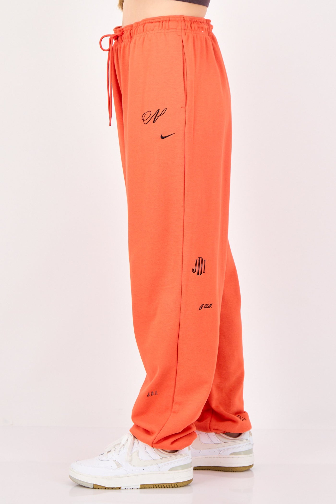 orange nike sweatpants womens