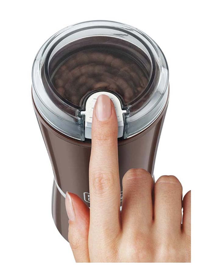 بلاك اند ديكر مطحنة القهوة ، سرعة واحدة مع نبض، كوب وشفرة  الفولاذ المقاوم للصدأ، غطاء بقفل أمان، طحن سريع وتحكم دقيق للقهوة، تصميم مدمج، 150 W CBM4-B5 بني - Image 2