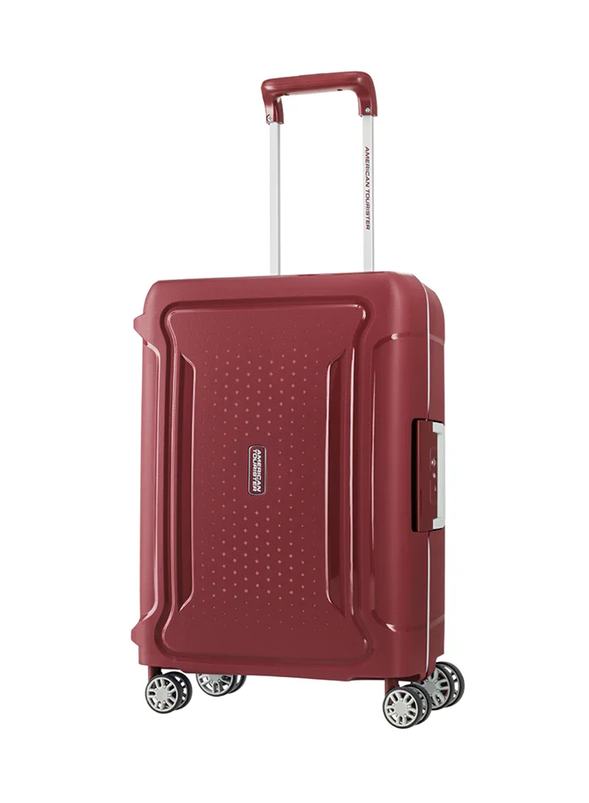American Tourister red Tribus Suitcase, Cabin Size 55 cm / 20 inch, 4 Spinner Wheels, Hard Top, Polypropylene, Red|Address Tag|TSA Lock|Dual Tube Pull Handle|Scratch Resistant Texture|XtraSecu™ 3-Point Locking System - 3 Years International Warranty Red  | Best Price UAE