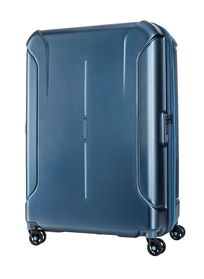 American Tourister Technum Suitcase, Check-In Size 77 cm / 28 inch, 4 Spinner Wheels, Hard Top, Polycarbonate, Metallic Blue|DuoSaf™ Security Zipper|Dual Tube Pull Handle|Expandable - 3 Years Global Warranty Metallic Blue - Image 1