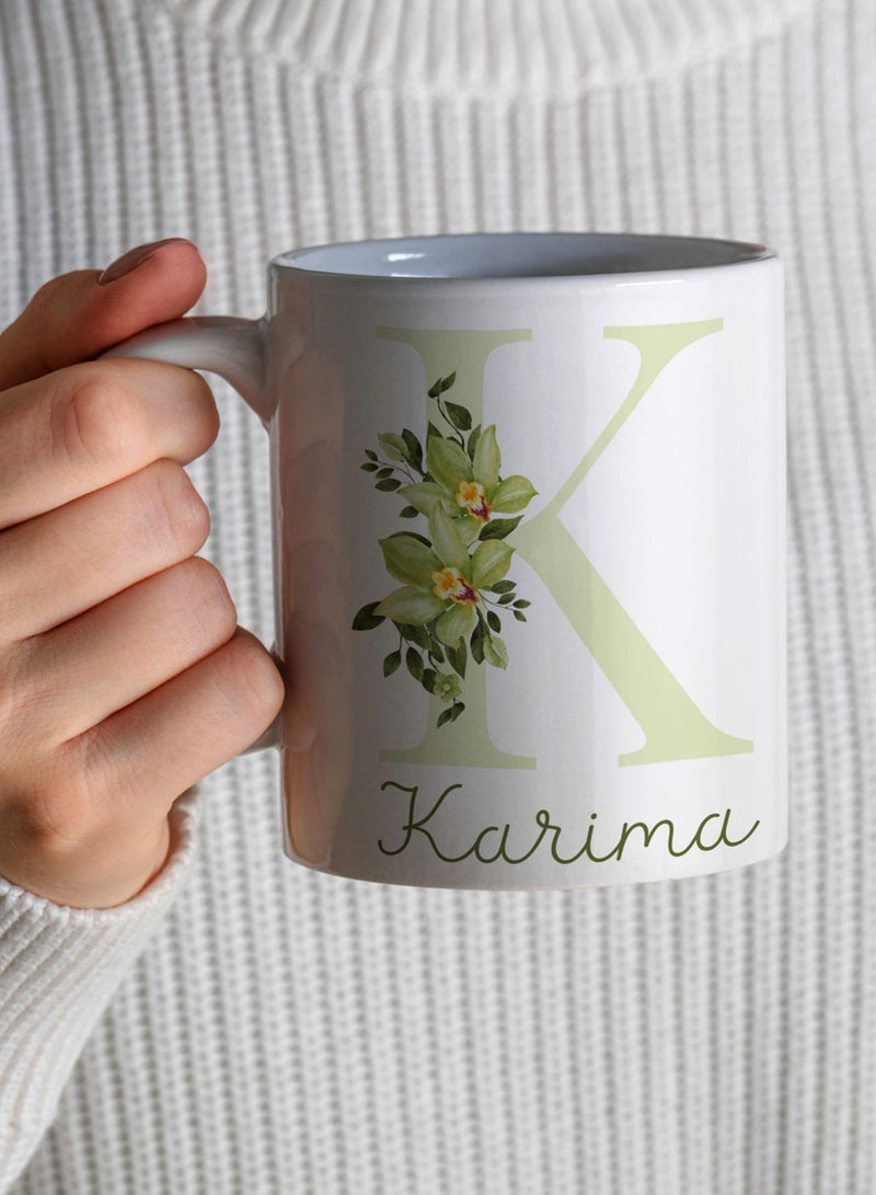 LOWHA - Customizable Ceramic 11 oz Mug with Personalized Name and Green Flowers on First Letter of The Name White - Image 1