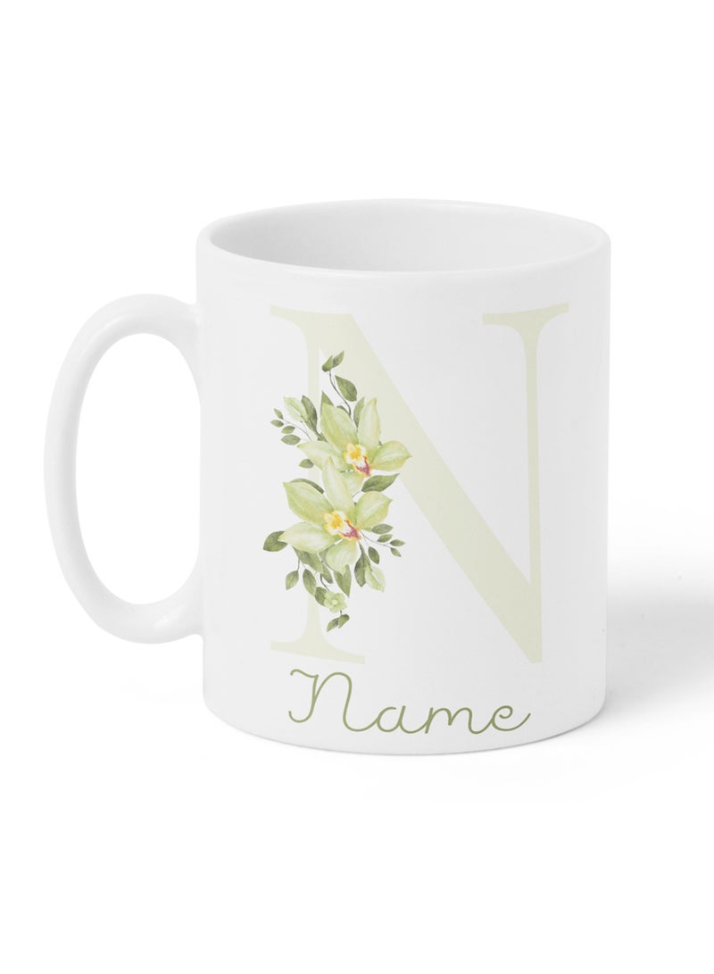LOWHA - Customizable Ceramic 11 oz Mug with Personalized Name and Green Flowers on First Letter of The Name White - Image 1