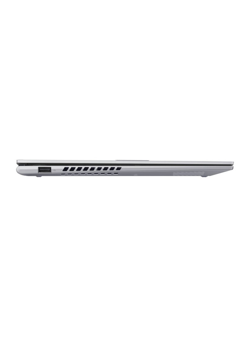 أسوس - ASUS Vivobook S14 Flip TP3402VA-EG009W Operating System	Windows 11 Home WUXGA (1920 x 1200) 14.0-inch IPS-level Panel Processor	Intel® Core™ i9-13900H Processor 2.6 GHz  On board memory	DDR4 16GB  Intergrated GPU Intel Iris Xᵉ Graphics  Storage 512GB M.2 NVMe™ PCIe® 4.0 SSD color (Cool Silver) Keyboard color (Silver) English/Arabic Cool Silver - Image 1