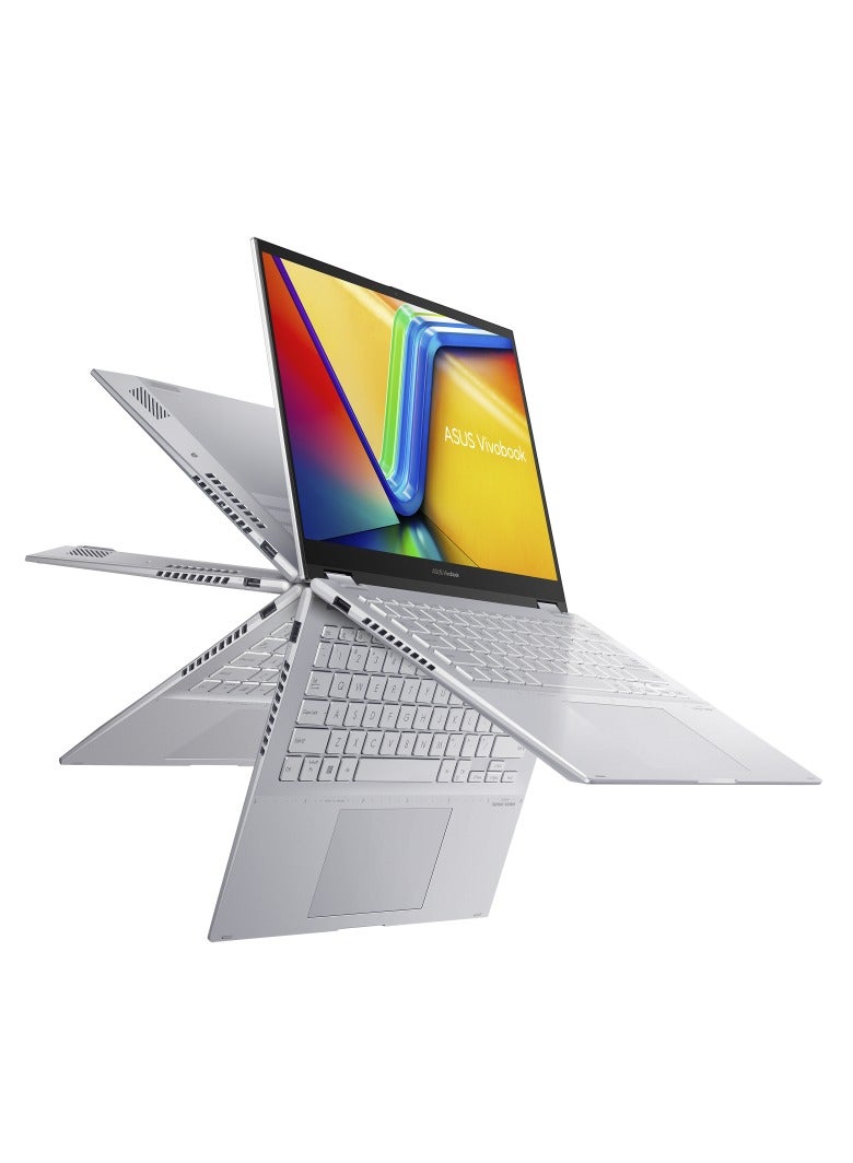 أسوس - ASUS Vivobook S14 Flip TP3402VA-EG009W Operating System	Windows 11 Home WUXGA (1920 x 1200) 14.0-inch IPS-level Panel Processor	Intel® Core™ i9-13900H Processor 2.6 GHz  On board memory	DDR4 16GB  Intergrated GPU Intel Iris Xᵉ Graphics  Storage 512GB M.2 NVMe™ PCIe® 4.0 SSD color (Cool Silver) Keyboard color (Silver) English/Arabic Cool Silver - Image 1