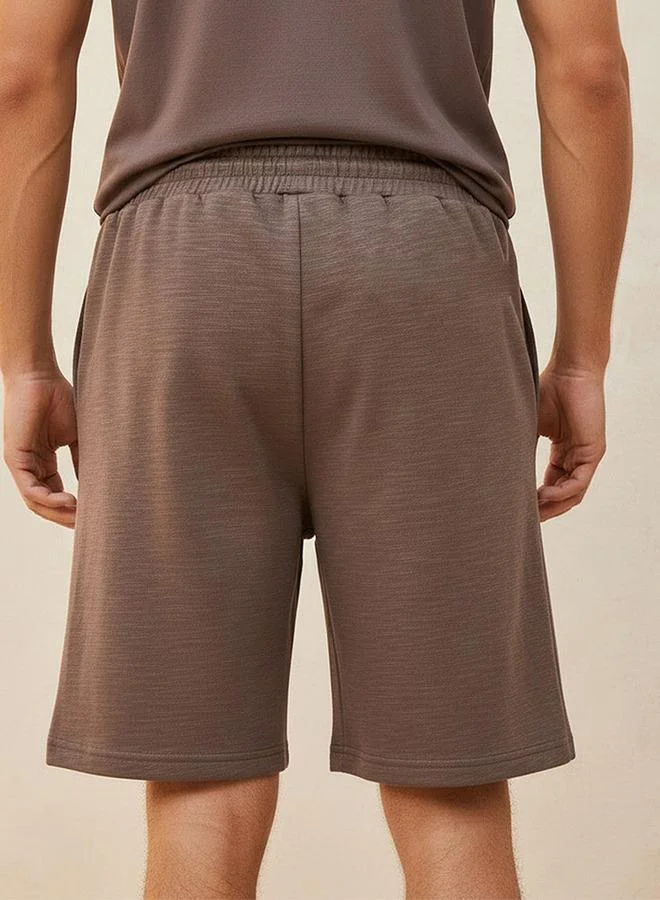 Kappa BROWN Kappa Men 2 Way Stretch Textured Shorts for Men | Best Price UAE