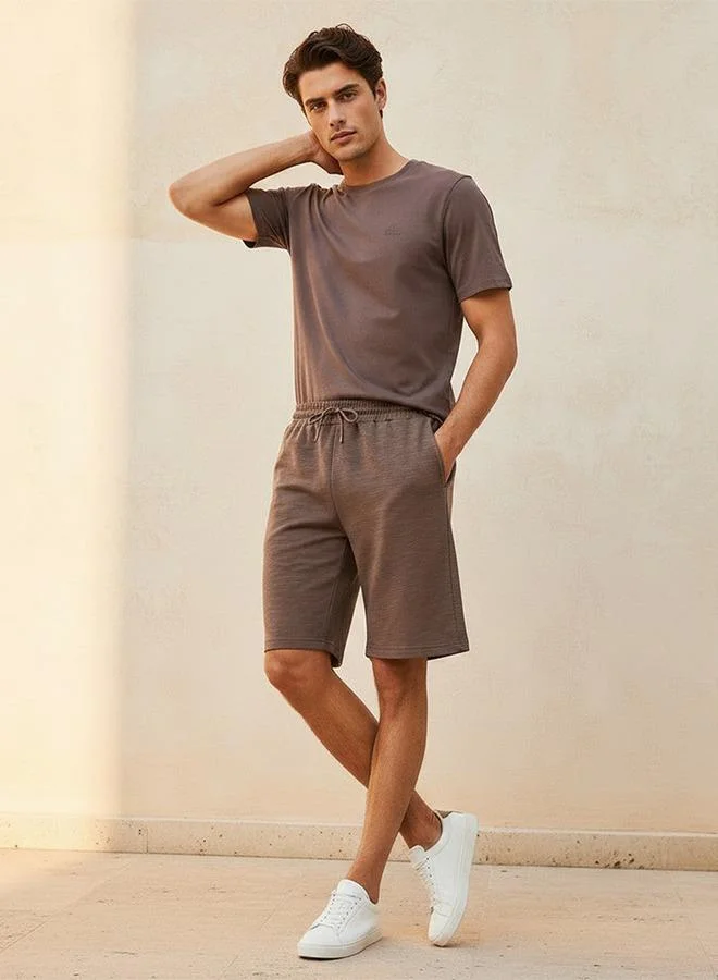 Kappa BROWN Kappa Men 2 Way Stretch Textured Shorts for Men | Best Price UAE