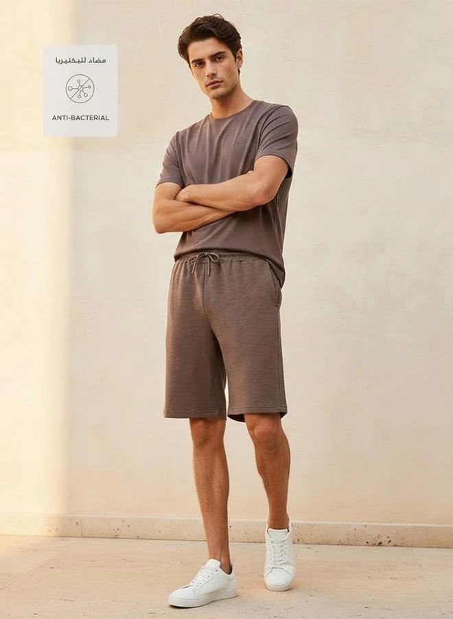 Kappa BROWN Kappa Men 2 Way Stretch Textured Shorts for Men | Best Price UAE