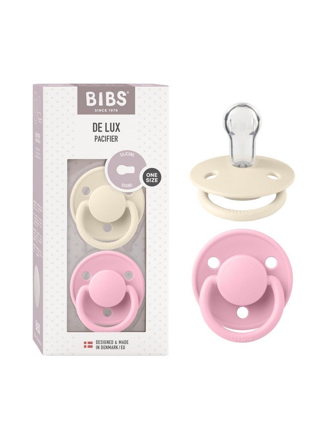 بيبس لهاية أطفال BIBS De Lux - عبوة من قطعتين | صنع في الدنمارك | لهاية خالية من مادة BPA، حلمة مستديرة، سيليكون، مقاس واحد (0-36 شهرًا)، عاجي/وردي فاتح - Image 1