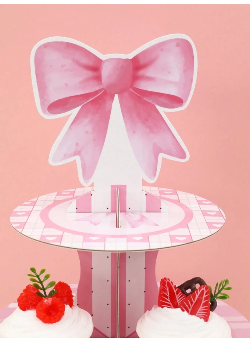 صحن حامل كب كيك مكون من ثلاث طبقات بتصميم فيونكه ورديه  يضيف لمسة جمالية لأي مناسبة مصنوع من كرتون قوي يوفر ثباتاً ممتازاً عند الاستخدام مناسب لتوزيعات حفلات اعياد الميلاد ، استقبال المولود الجديد و جميع المناسبات الخاصه - Image 3