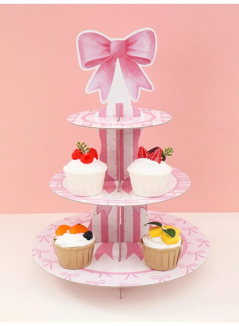 صحن حامل كب كيك مكون من ثلاث طبقات بتصميم فيونكه ورديه  يضيف لمسة جمالية لأي مناسبة مصنوع من كرتون قوي يوفر ثباتاً ممتازاً عند الاستخدام مناسب لتوزيعات حفلات اعياد الميلاد ، استقبال المولود الجديد و جميع المناسبات الخاصه - Image 5