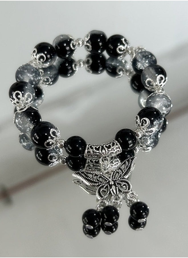 ماركة غير محددة سوار مرصّع بتصميم الكسر الجليدي مع pendant على شكل فراشة – صنع يدوي من الزجاج الفاخر، تصميم بألوان متعددة، أسلوب حلقات رفيع مناسب للرجال والنساء، مظهر جذاب.  - Image 1
