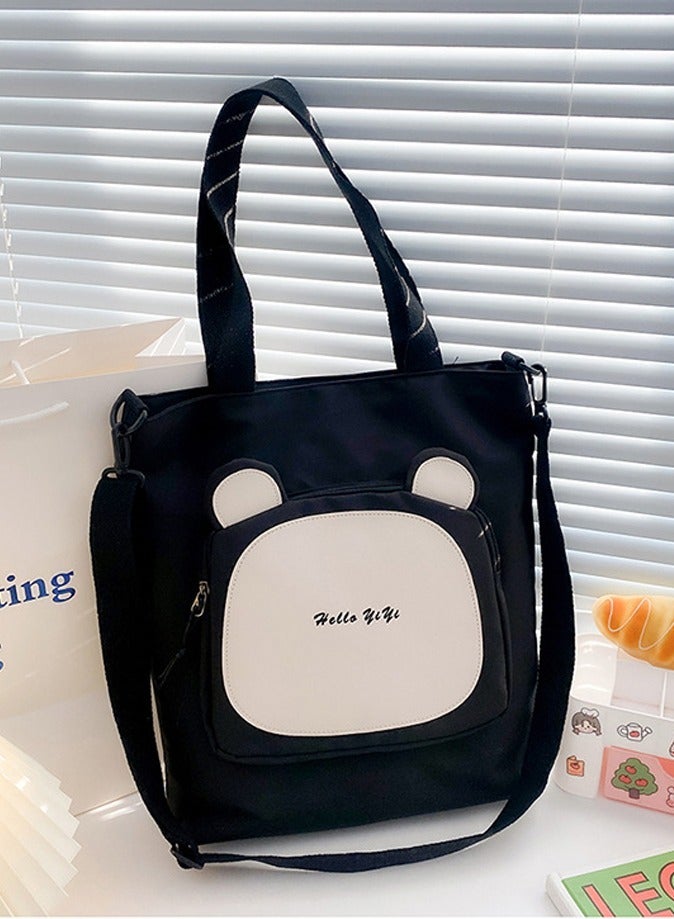 Joychic حقيبة كتف مقاومة للماء بجيب أمامي من النايلون برسوم كرتونية بسحاب مضاد للسرقة لحقيبة مدرسية للطلاب في المرحلة الابتدائية والمتوسطة والثانوية باللون الأسود - Image 1