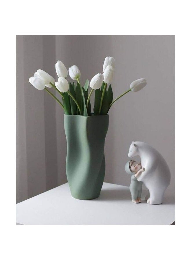 Razz Gallery The Wavy Green Vase is a decorative piece that combines softness with artistic details, giving any space a sense of luxury and harmony. - Image 1
