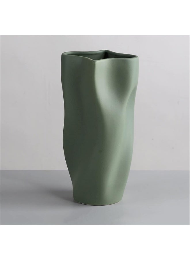 Razz Gallery The Wavy Green Vase is a decorative piece that combines softness with artistic details, giving any space a sense of luxury and harmony. - Image 2