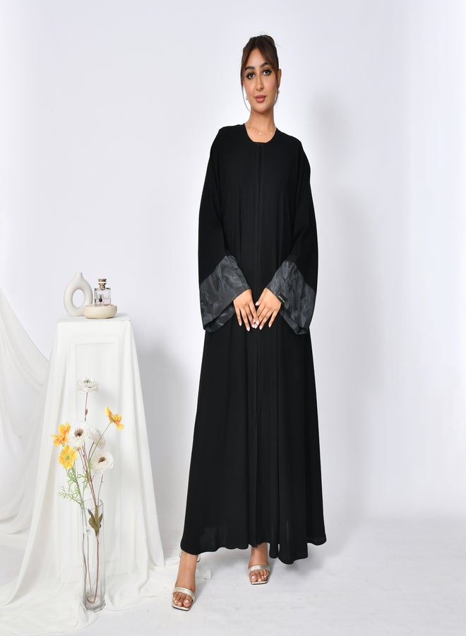 HAWRAA ABAYA Elegant abaya with a closed cloche cut and a silk jacquard insert on the sleeves. - Image 1