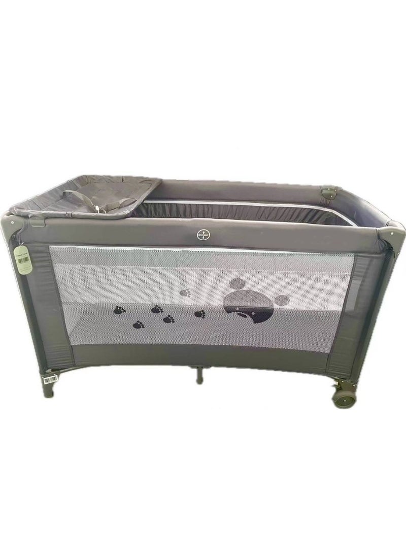 A baby bed a double playpen and a diaper changing table