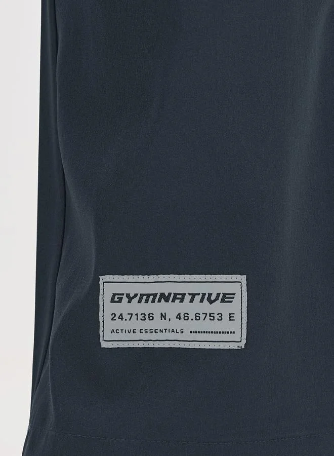 Styli Cargo Pocket Oversized Woven Athleisure Pants with Badge
