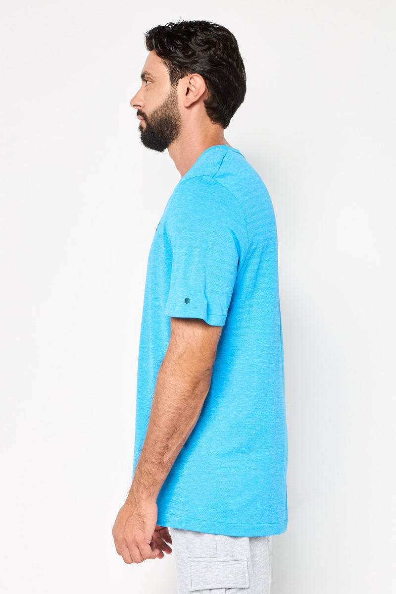 UNDER ARMOUR تي شيرت رياضي للرجال بأكمام قصيرة مناسب للخارج، تركواز - Image 3