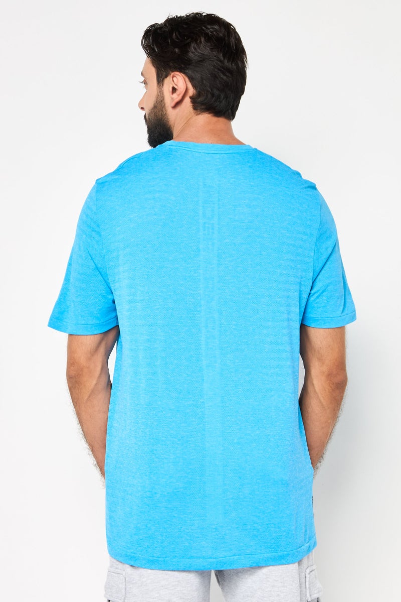 UNDER ARMOUR تي شيرت رياضي للرجال بأكمام قصيرة مناسب للخارج، تركواز - Image 4
