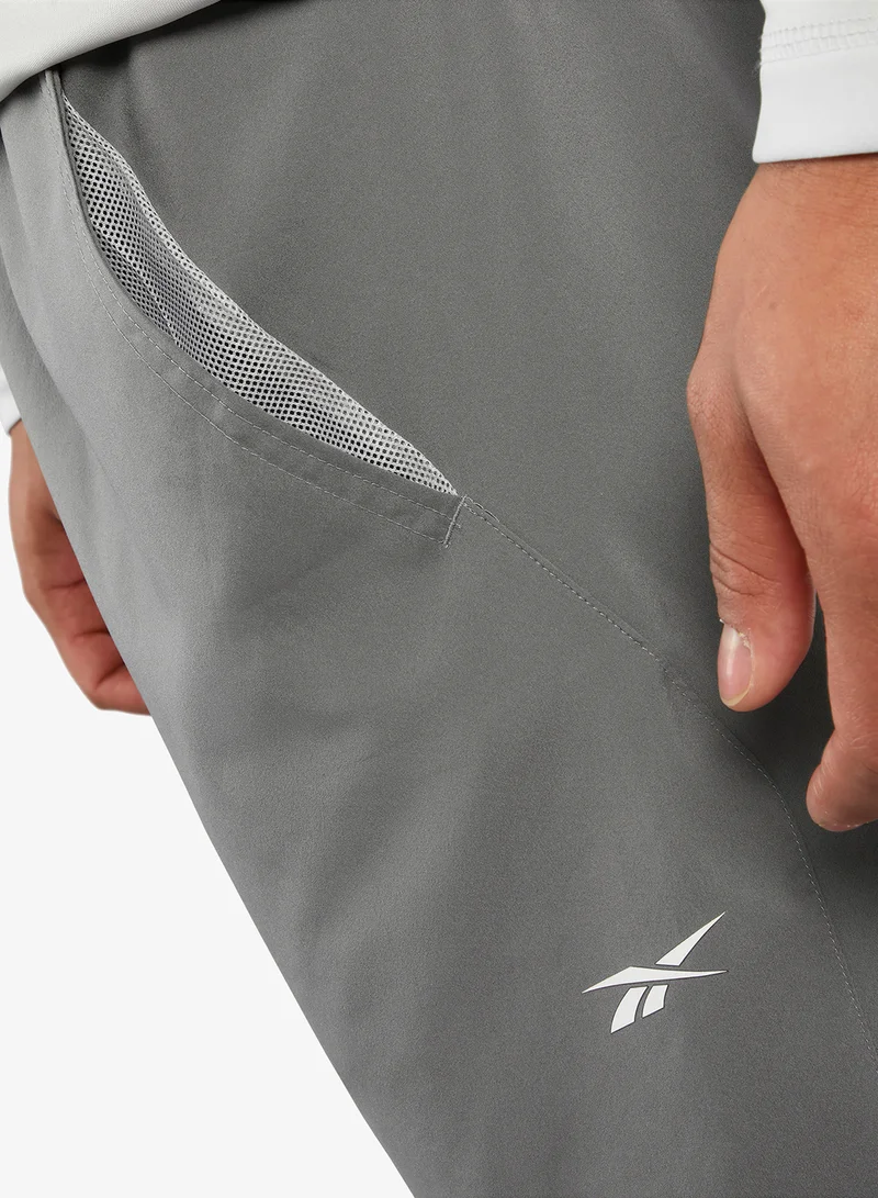 Reebok  Identity Train Woven Unlined Sweatpants for Men | Best Price UAE