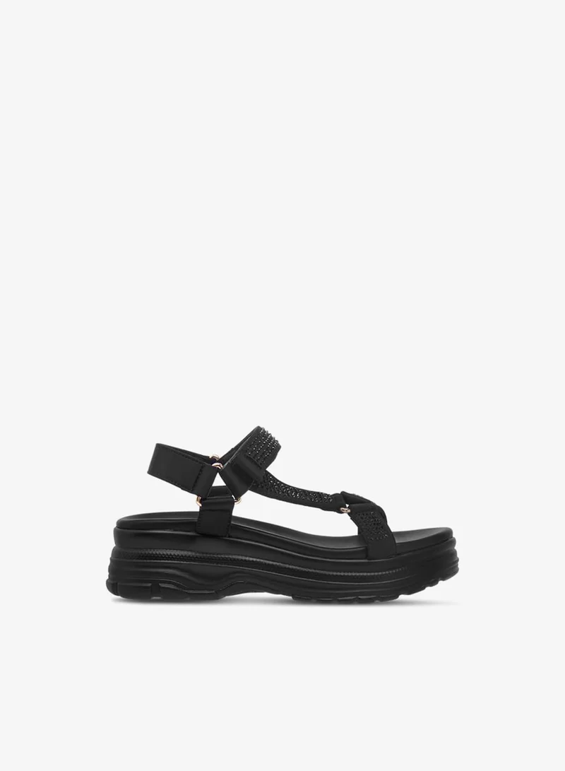 لو كونفورت صنادل بناتي بنعل سميك مزين بشريط إغلاق لاصق