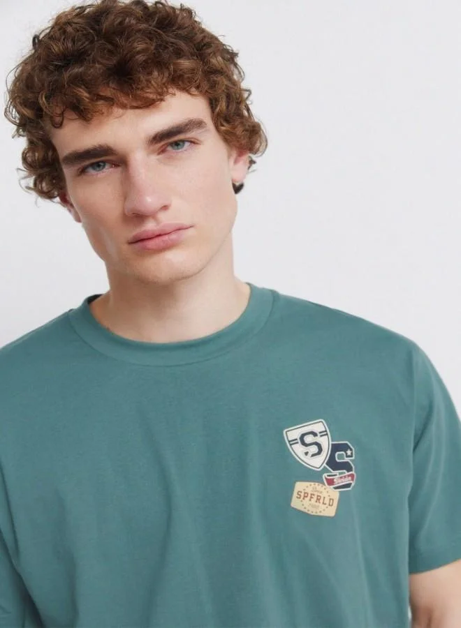 Springfield  Cotton loose fit short sleeve ribbed neck chest and back print T-shirt for Men | Best Price UAE