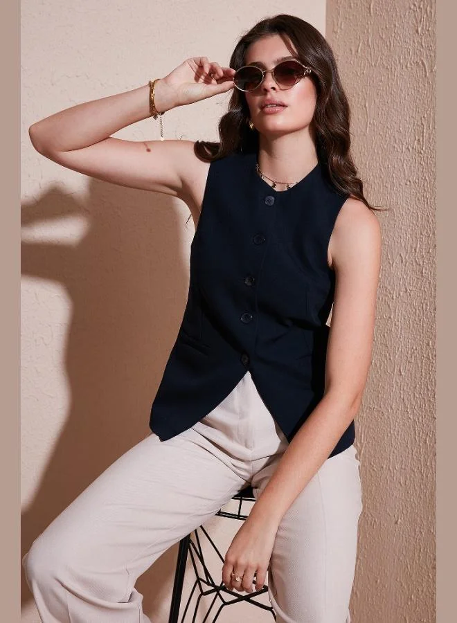 ليلا بلوزة نسائية بدون أكمام بياقة دائرية وأزرار من ليلا