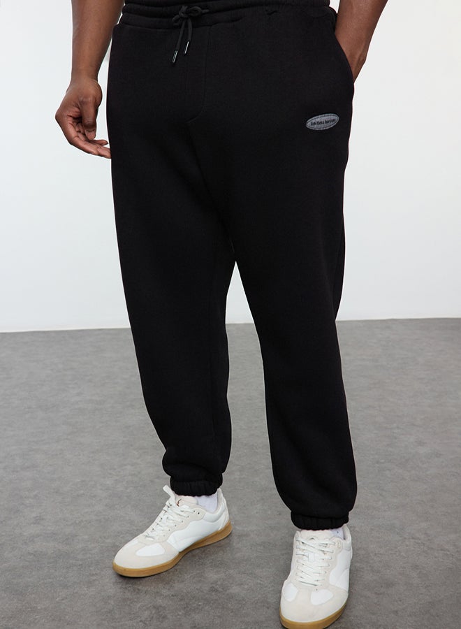 trendyol Plus Size Black Oversize/Wide Cut Pocket Labeled Sweatpants TMNAW25AJ00001 - Image 1