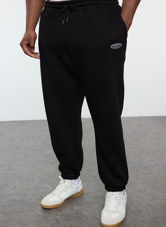 trendyol Plus Size Black Oversize/Wide Cut Pocket Labeled Sweatpants TMNAW25AJ00001 - Image 1