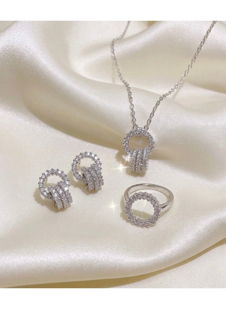 Nevara An elegant women's jewelry set featuring a necklace, earrings, and a ring with a circular design studded with sparkling crystals, offering a sophisticated, modern look suitable for special occasions, evening events, and everyday wear. - Image 2