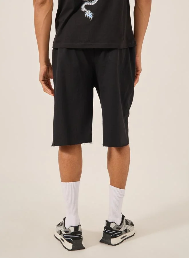 Styli Solid Raw Edge Hem Terry Oversized Shorts
