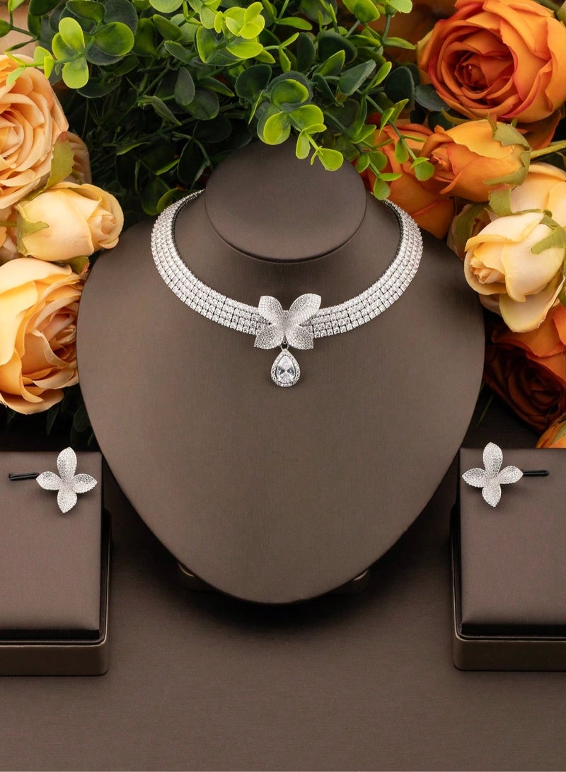 Women's accessories set consisting of a necklace and earrings in silver with a flower design studded with shiny stones, suitable for brides, engagement parties, and all special occasions  - Image 1