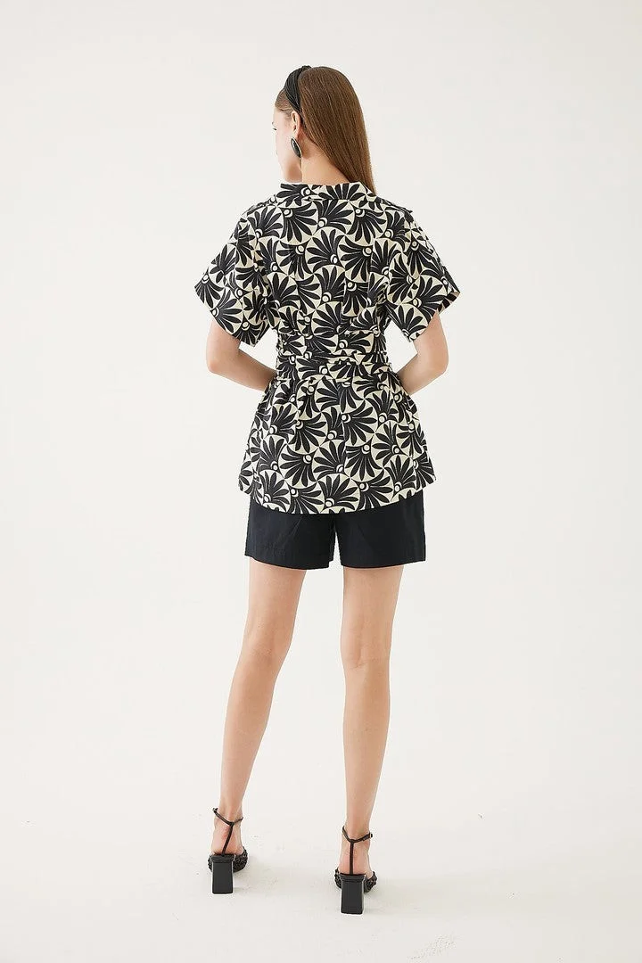 EXQUISE Wrap-style blouse with leaf pattern.