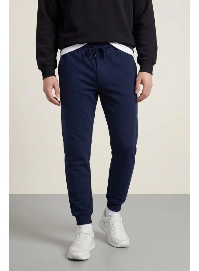 Men's Navy Blue Regular Fit Sweatpants with Elasticated Cuffs and Back Pocket Label Detail