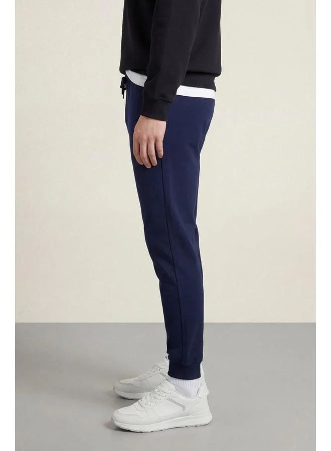 Mmetalic  Men's Navy Blue Regular Fit Sweatpants with Elasticated Cuffs and Back Pocket Label Detail for Men | Best Price UAE