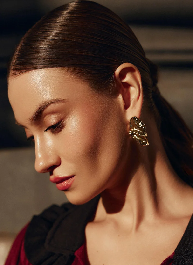 Large stud earrings in crumpled metal
