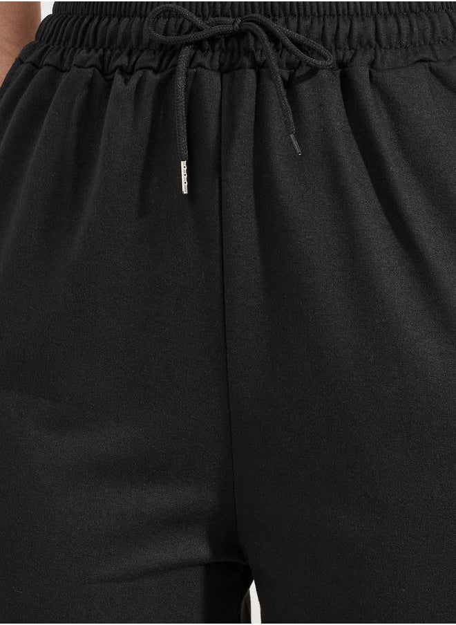 Solid Drawcord Waistband Straight Joggers - pzsku/Z017AF102F432E17670E9Z/45/_/1720784469/dbd5031a-d143-49ae-bbb1-82cd632e0a49