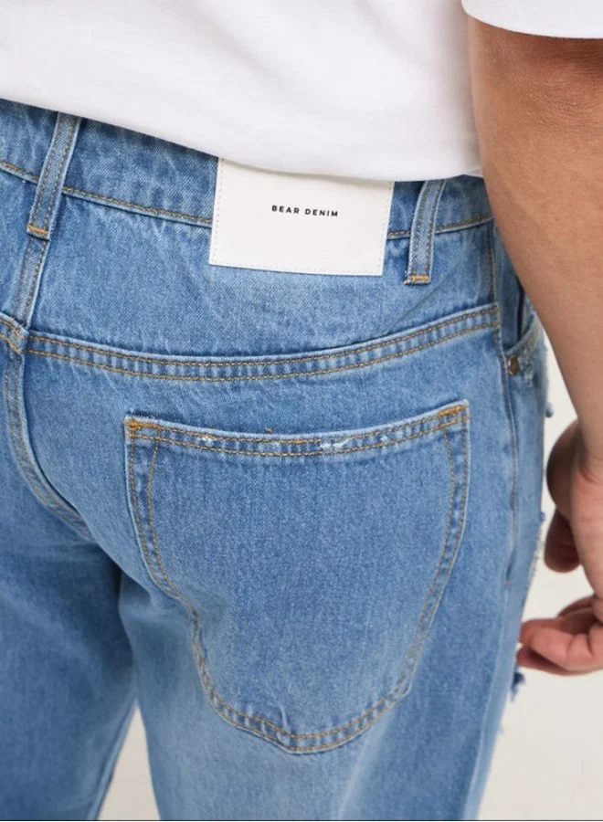 The Bear House  Men's Light Blue with Light Fade Distressed Mid-Rise Relaxed Fit Jeans Classic Comfort With Modern Style, Perfect For Everyday Casual Looks And Effortless Streetwear Vibes for Men | Best Price UAE
