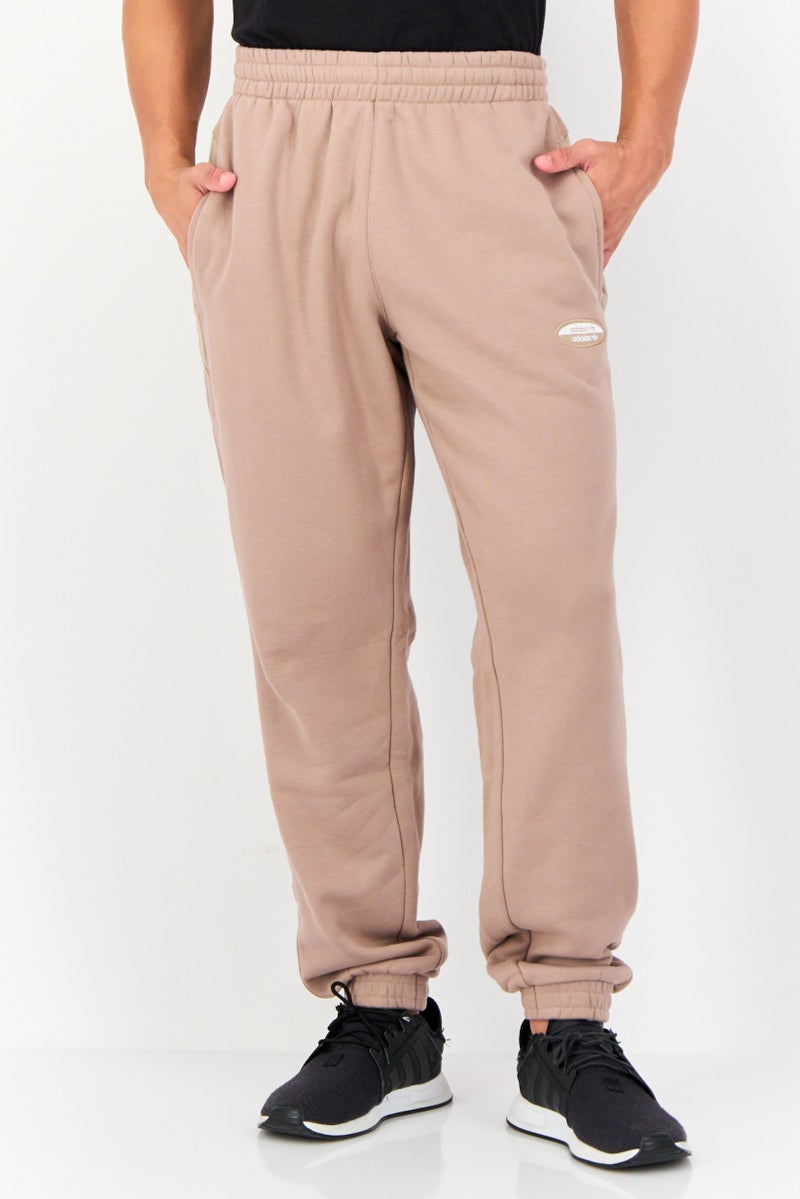 adidas Originals Men Sportswear Fit Brand Logo Outdoor Sweatpants, Light Brown  - Image 1