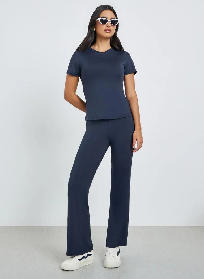 Styli Dark Blue Solid T-Shirt and Flared Leggings Co-Ords