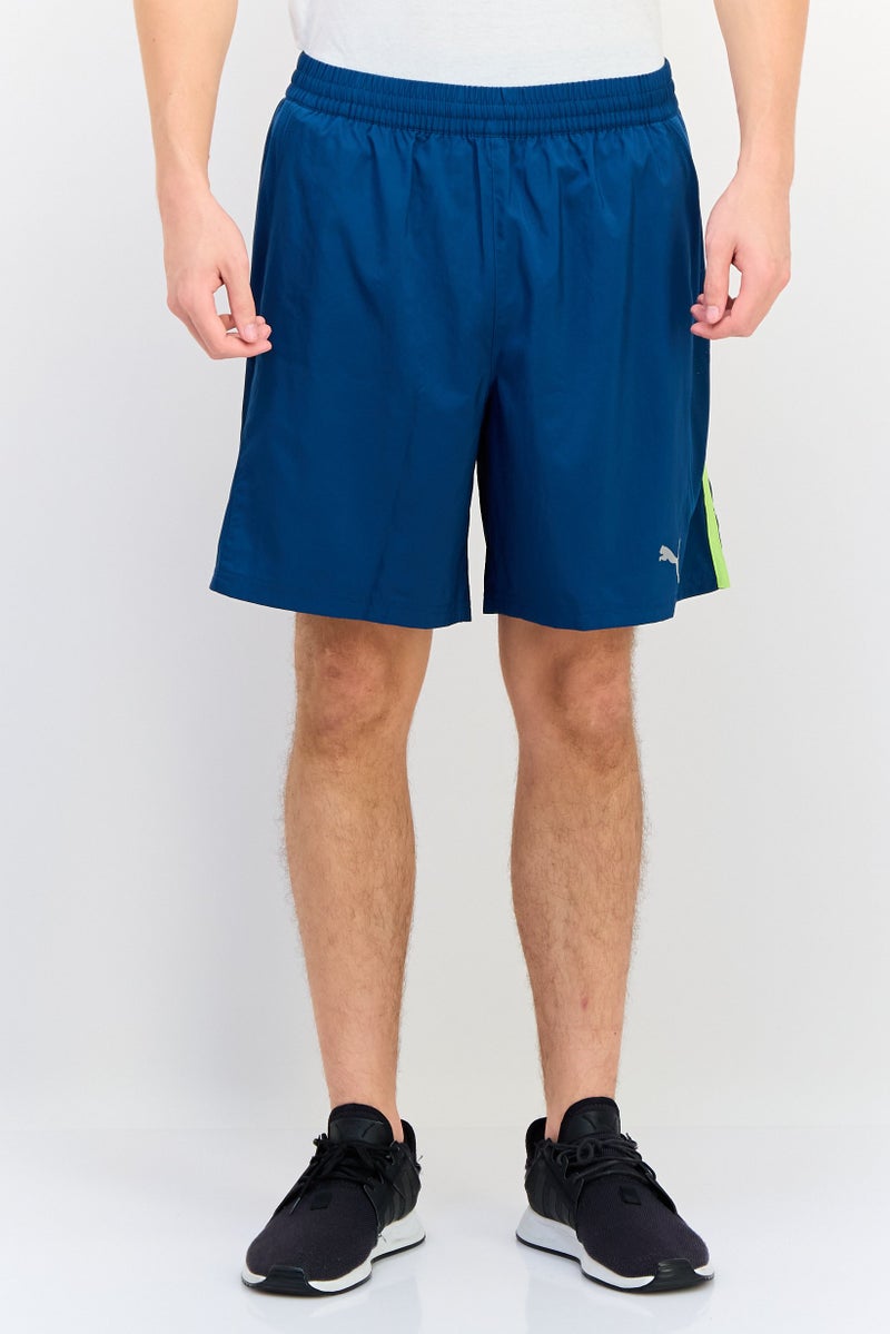 PUMA Men Sportswear Fit 7 Inseam Brand Logo Running Shorts, Teal Blue - Image 1