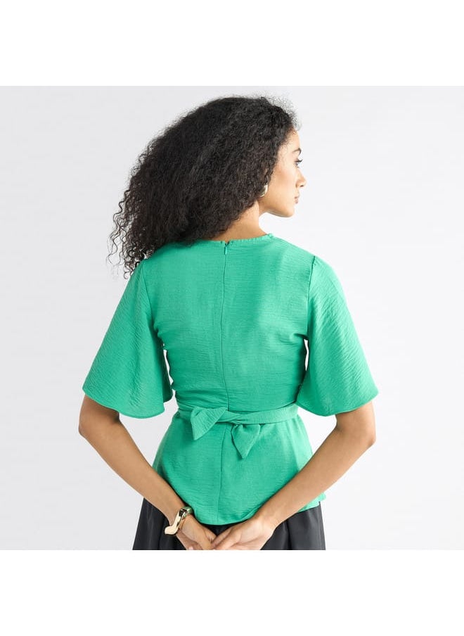 FAV - Solid V-neck Top with Flutter Sleeves and Knot Detail - Image 1