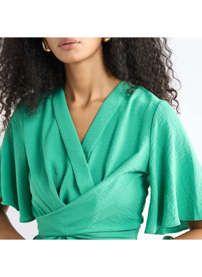 FAV - Solid V-neck Top with Flutter Sleeves and Knot Detail - Image 1