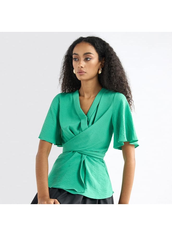 FAV - Solid V-neck Top with Flutter Sleeves and Knot Detail - Image 1