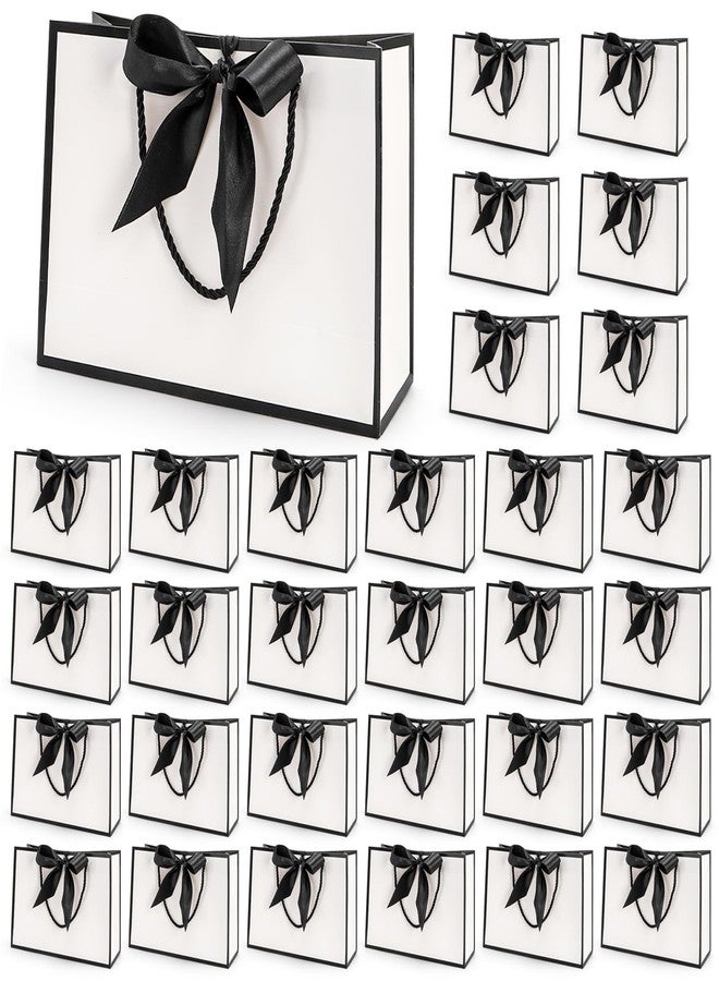 تيبري أكياس هدايا تيبيري، عبوة من 30 كيسًا بمقبض، أكياس ورقية متوسطة الحجم مزينة بشريط، أكياس تغليف بيضاء وسوداء لحفلات عيد الحب، وحفلات الزفاف، وحفلات وصيفات العروس، وأعياد الميلاد، وحفلات التخرج، وحفلات الانتقال إلى منزل جديد، مقاس 11 × 3.9 × 7.8 بوصة - Image 5