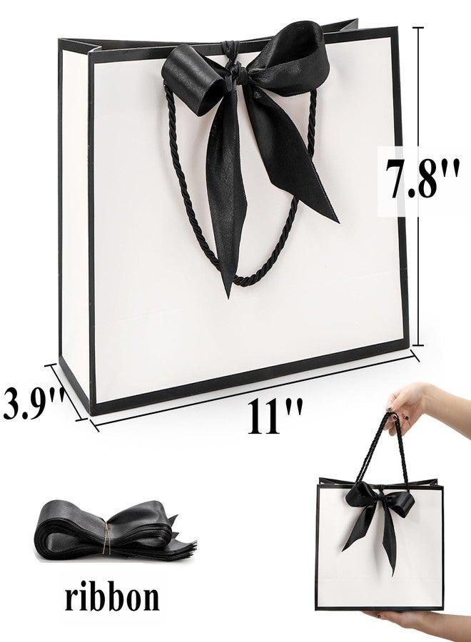 تيبري أكياس هدايا تيبيري، عبوة من 30 كيسًا بمقبض، أكياس ورقية متوسطة الحجم مزينة بشريط، أكياس تغليف بيضاء وسوداء لحفلات عيد الحب، وحفلات الزفاف، وحفلات وصيفات العروس، وأعياد الميلاد، وحفلات التخرج، وحفلات الانتقال إلى منزل جديد، مقاس 11 × 3.9 × 7.8 بوصة - Image 2