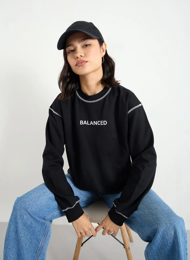 Styli Styli Black Longline Embroidered Slogan Sweatshirt
