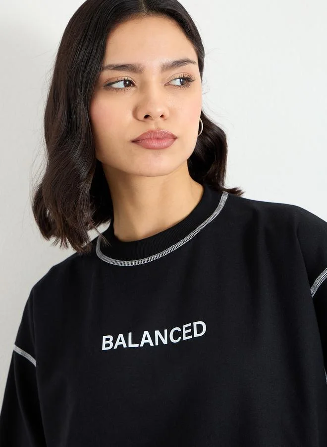 Styli Styli Black Longline Embroidered Slogan Sweatshirt