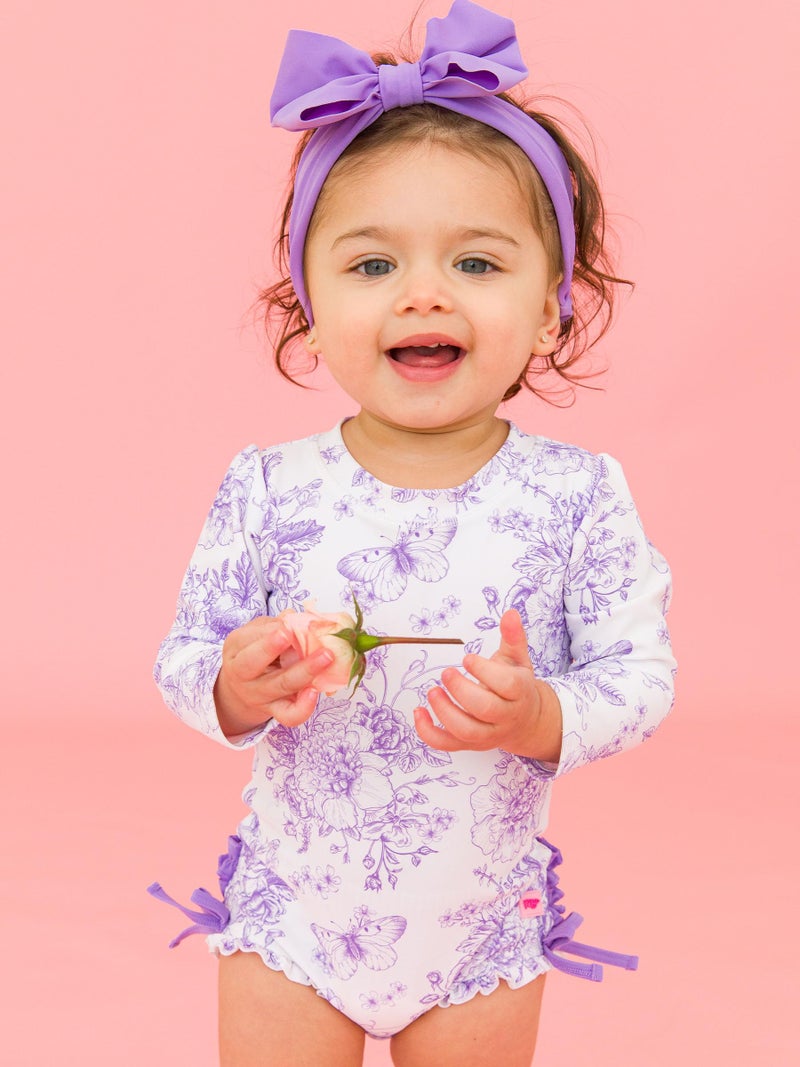 RuffleButts Baby Girls UPF 50+ Sun Protection Floral Printed Long Sleeve One Piece Rash Guard Swimsuit with Zipper - Wisteria Purple Butterfly Garden Toile, 2T - Image 2