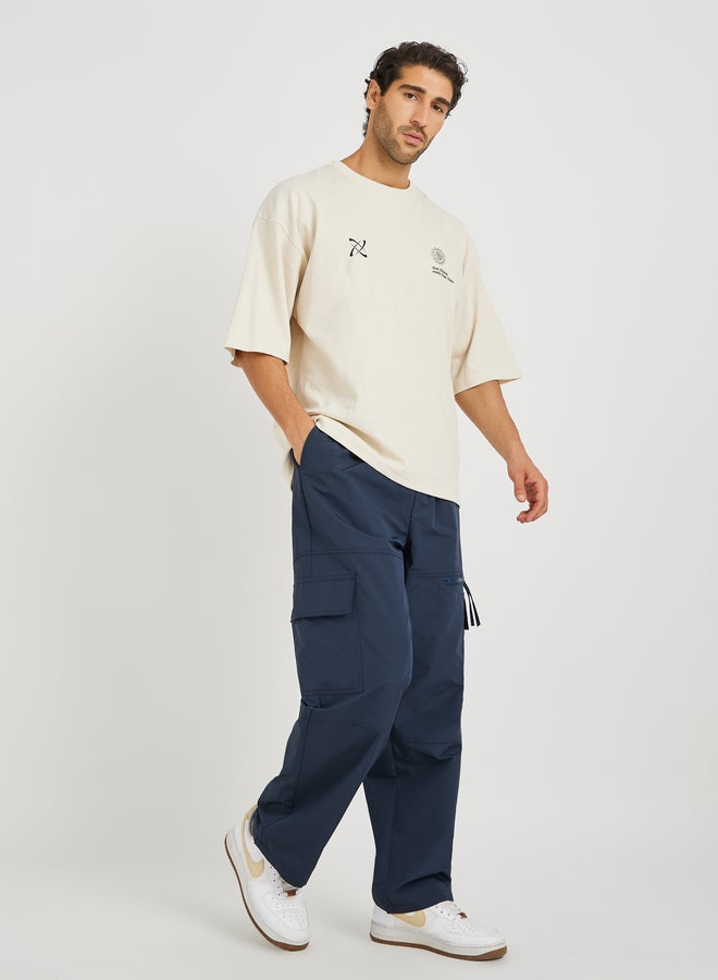 Styli Styli Men Navy Blue Solid Oversized Open Hem Cargo Joggers with Zipper Pockets  - Image 2